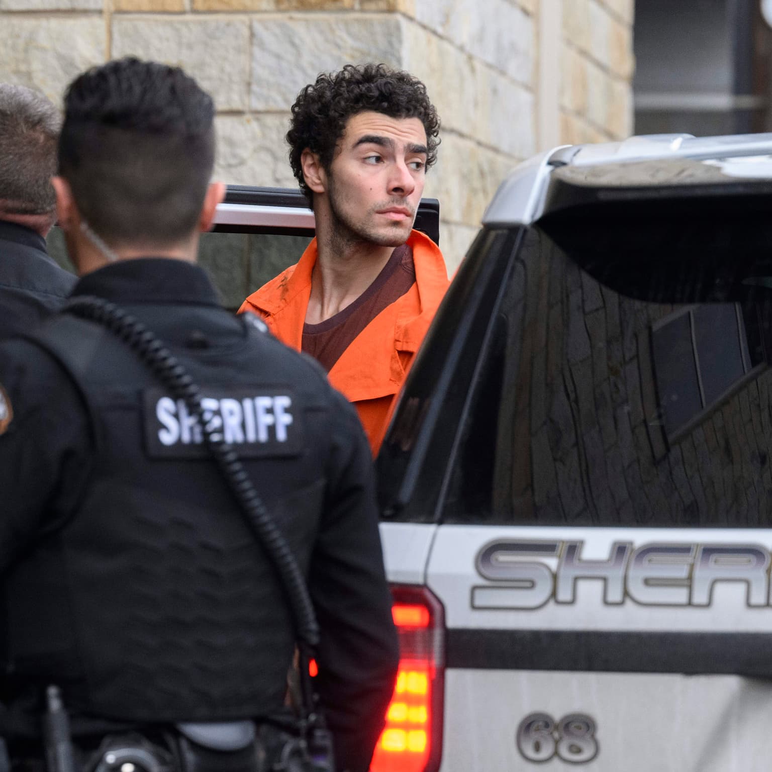 A suspect is in custody. Some Americans are celebrating his alleged actions artwork