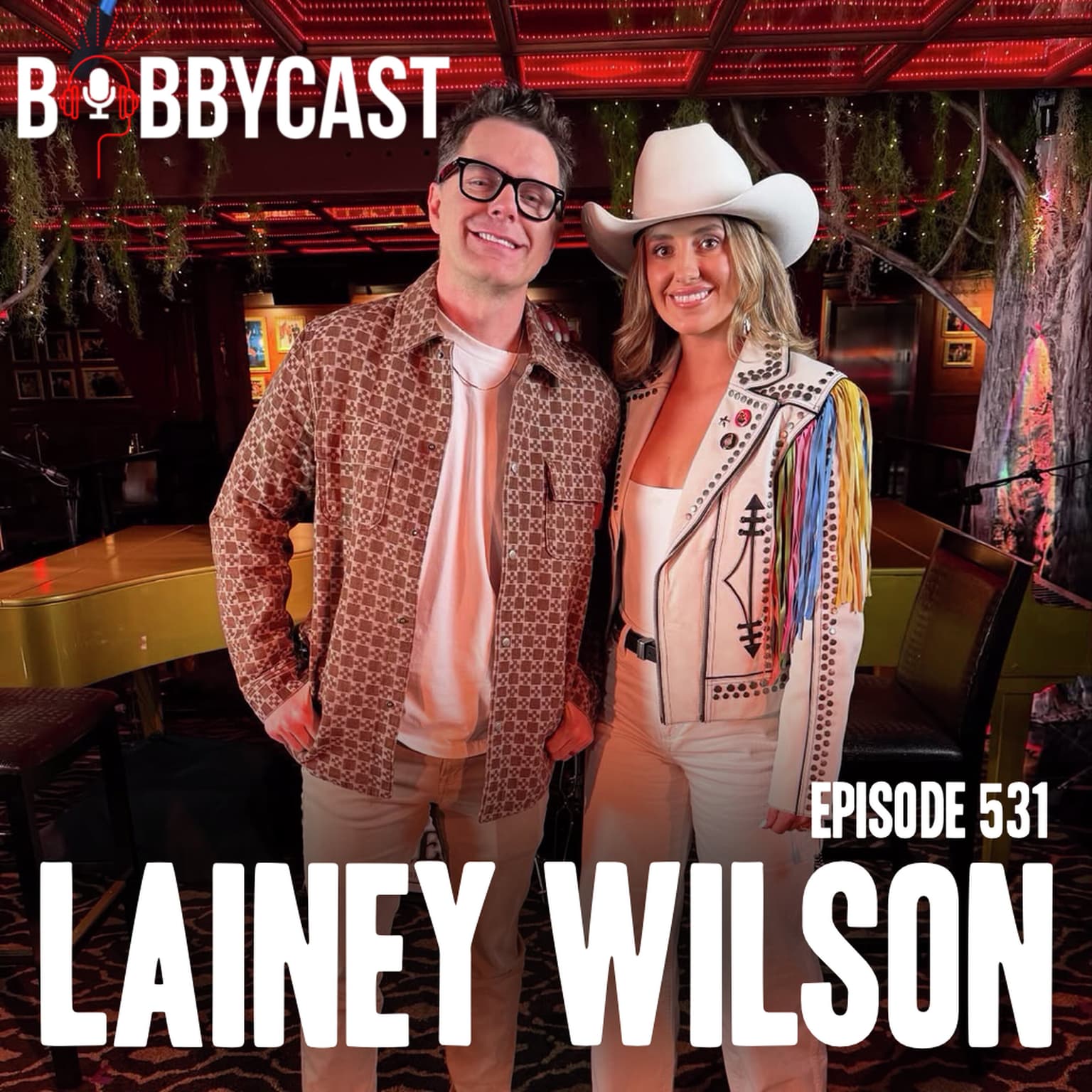 BOBBYCAST: Lainey Wilson on the Impact Fame Has Had on Her Family + Her Fiancée Keeping Her Grounded & Who She Takes Advice From + The Importance of Having Grace for Herself and Her Performances + Bobby Reviews His Summer Notes on Movies and TV Shows He Watched artwork