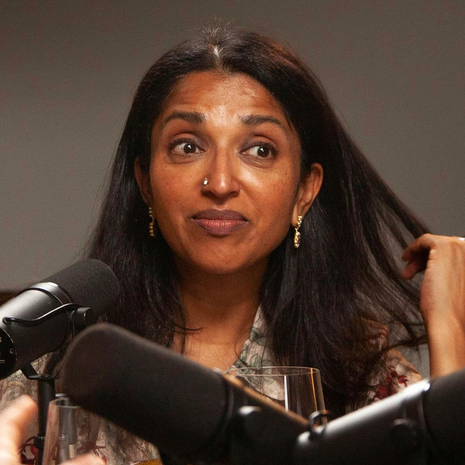 Award-winning comedian Sindhu Vee and a pomegranate Margarita artwork